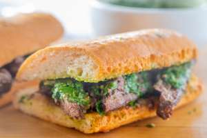 Steak Sandwich on a Gluten-Free Hoagie Roll with Chimichurri Sauce